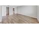 This room has wood floors, neutral paint, a view of the bathroom, and is flooded with natural light at 101 S Gulfstream Ave # 15C, Sarasota, FL 34236