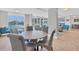 Bright clubhouse with tile flooring, modern furniture, and floor to ceiling windows at 101 S Gulfstream Ave # 15C, Sarasota, FL 34236
