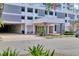 Exterior of condominium entrance with landscaped planters and garage for residents at 101 S Gulfstream Ave # 15C, Sarasota, FL 34236
