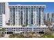 Luxurious high-rise condo building with a rooftop pool, balconies, and stunning architecture at 101 S Gulfstream Ave # 15C, Sarasota, FL 34236