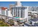 Exterior of condo with a pool on top of garage with cityscape views from multiple balconies at 101 S Gulfstream Ave # 15C, Sarasota, FL 34236