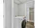 A clean laundry area with a washer and dryer, conveniently located near the bathroom at 101 S Gulfstream Ave # 15C, Sarasota, FL 34236