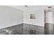 Bright, open living room with neutral walls and dark tile flooring, ready for personalization at 101 S Gulfstream Ave # 15C, Sarasota, FL 34236
