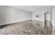Bright, open living room with neutral walls and dark tile flooring, ready for personalization at 101 S Gulfstream Ave # 15C, Sarasota, FL 34236