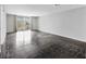 Spacious living room featuring tile floors, a sliding glass door to the balcony, and natural light at 101 S Gulfstream Ave # 15C, Sarasota, FL 34236