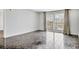 This open living room features tile floors, a balcony view, and plenty of natural light at 101 S Gulfstream Ave # 15C, Sarasota, FL 34236