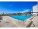 Outdoor swimming pool with seating and lounge chairs at 101 S Gulfstream Ave # 15C, Sarasota, FL 34236