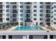 Bright community pool with turquoise water and balcony views on a sunny day at 101 S Gulfstream Ave # 15C, Sarasota, FL 34236
