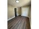 A cozy bedroom with vinyl flooring and white double door closet at 1132 26Th S Ave, St Petersburg, FL 33705