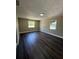A bright bedroom features wood floors and large windows that let in ample natural light at 1132 26Th S Ave, St Petersburg, FL 33705