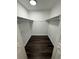 A spacious walk-in closet with wood floors and plenty of shelving for storage and organization at 1132 26Th S Ave, St Petersburg, FL 33705