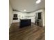 Modern kitchen with white cabinets, stainless steel appliances, and a stylish center island at 1132 26Th S Ave, St Petersburg, FL 33705