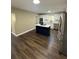 Modern kitchen with white cabinets, stainless steel appliances, and a stylish center island at 1132 26Th S Ave, St Petersburg, FL 33705