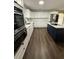 Modern kitchen with white cabinets, stainless steel appliances, and a stylish center island at 1132 26Th S Ave, St Petersburg, FL 33705