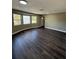 Bright living room boasts wood floors, large windows, and ample natural light at 1132 26Th S Ave, St Petersburg, FL 33705