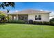 Well-maintained home with a grassy backyard and screened-in patio at 11610 Griffith Park Ter, Bradenton, FL 34211
