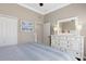 Cozy bedroom features white furniture and calm colored accents at 11610 Griffith Park Ter, Bradenton, FL 34211