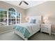Bright bedroom features a large window and calming decor at 11610 Griffith Park Ter, Bradenton, FL 34211