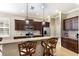 Well-equipped kitchen featuring a center island, granite countertops, stainless steel appliances, and ample cabinet space at 11610 Griffith Park Ter, Bradenton, FL 34211