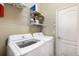 Laundry room with full-size washer and dryer at 11610 Griffith Park Ter, Bradenton, FL 34211