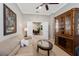 A living room with neutral walls, access to another room, a sofa, and decor at 11610 Griffith Park Ter, Bradenton, FL 34211