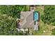 Aerial view of home showing roof, screen enclosed pool and outdoor seating area at 13640 2Nd E Ave, Bradenton, FL 34212