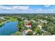 Expansive aerial view of the property showcasing its lakeside location and lush surrounding landscape at 13640 2Nd E Ave, Bradenton, FL 34212