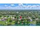 Beautiful home with a scenic aerial view highlighting its mature trees and proximity to the lake at 13640 2Nd E Ave, Bradenton, FL 34212