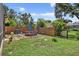 Fenced backyard with a patio dining area and a grill, perfect for outdoor gatherings at 13640 2Nd E Ave, Bradenton, FL 34212