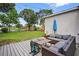 Outdoor patio area with seating, a view of a playground, and a pond, providing a relaxing outdoor experience at 13640 2Nd E Ave, Bradenton, FL 34212