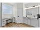 Bright bathroom featuring a dual sink vanity, makeup area, and modern fixtures, all illuminated by natural light at 13640 2Nd E Ave, Bradenton, FL 34212