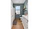 Well-lit bathroom featuring a white vanity, window, and modern fixtures at 13640 2Nd E Ave, Bradenton, FL 34212