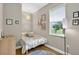 Cozy bedroom with a window view, hardwood floors and charming decor at 13640 2Nd E Ave, Bradenton, FL 34212