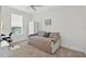 Neutral bedroom featuring a ceiling fan, daybed, and window at 13640 2Nd E Ave, Bradenton, FL 34212