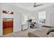 Neutral bedroom with ceiling fan, desk and daybed at 13640 2Nd E Ave, Bradenton, FL 34212