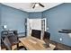 Home office with blue walls, hard wood floors, and french doors at 13640 2Nd E Ave, Bradenton, FL 34212