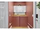 Laundry room with custom cabinets and wood countertop at 13640 2Nd E Ave, Bradenton, FL 34212