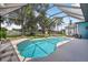 Beautiful screened-in pool and patio area with lake views, perfect for relaxing and entertaining at 13640 2Nd E Ave, Bradenton, FL 34212