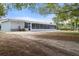 Spacious backyard showcasing the property's large screen porch, a great space for outdoor relaxation at 1404 Dartmouth Dr, Bradenton, FL 34207
