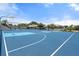 Bright blue basketball and pickleball courts, perfect for recreation and sports activities at 1404 Dartmouth Dr, Bradenton, FL 34207