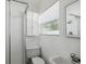Bright bathroom features a walk-in shower and a window at 1404 Dartmouth Dr, Bradenton, FL 34207