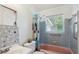 Bathroom featuring colorful shower curtain and window view at 1404 Dartmouth Dr, Bradenton, FL 34207