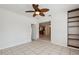 Neutral dining area featuring tiled floors, a ceiling fan, and easy access to the kitchen at 1404 Dartmouth Dr, Bradenton, FL 34207