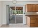 Kitchen with sliding glass door to the screened-in patio at 1404 Dartmouth Dr, Bradenton, FL 34207