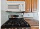 A close up of the kitchen's stove and microwave at 1404 Dartmouth Dr, Bradenton, FL 34207