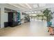 Community pool entrance featuring vending machines, tropical plants, and a glimpse of the outdoor pool area at 1404 Dartmouth Dr, Bradenton, FL 34207