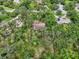 Expansive aerial view of a single Gathering home surrounded by mature trees and lush greenery at 1509 Shadow Ridge Cir, Sarasota, FL 34240