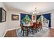 Classic dining room with seating for six and views of the backyard at 1509 Shadow Ridge Cir, Sarasota, FL 34240