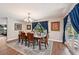 Elegant dining room featuring backyard pool views through the window at 1509 Shadow Ridge Cir, Sarasota, FL 34240