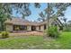 Charming stone home featuring lush landscaping and a welcoming facade at 1509 Shadow Ridge Cir, Sarasota, FL 34240
